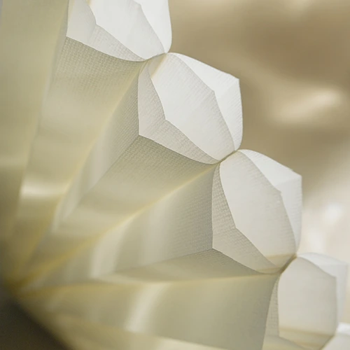 Close-up of double honeycomb shades for skylights, featuring a unique honeycomb-within-honeycomb structure.