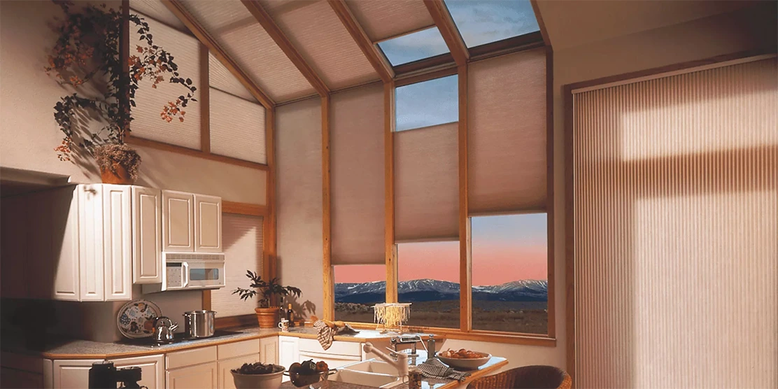 Kitchen with energy-efficient shades for skylights reduces heat and glare